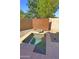 A relaxing backyard featuring a small pool and desert landscaping at 3581 S Arizona Pl, Chandler, AZ 85286
