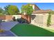 Well maintained backyard area with artificial turf, landscaping and patio at 3581 S Arizona Pl, Chandler, AZ 85286