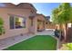 This backyard space features artificial turf, a small pool, and a covered patio at 3581 S Arizona Pl, Chandler, AZ 85286
