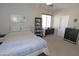 Cozy bedroom with neutral tones, a comfortable bed, and ample natural light at 3581 S Arizona Pl, Chandler, AZ 85286