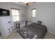 Serene bedroom with soft lighting, a comfortable bed, and a ceiling fan at 3581 S Arizona Pl, Chandler, AZ 85286