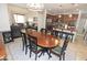 Open dining area with seating for six, connects seamlessly to a kitchen and living space at 3581 S Arizona Pl, Chandler, AZ 85286