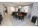 Open dining space is illuminated by a chandelier, connected to the living room and entry area at 3581 S Arizona Pl, Chandler, AZ 85286