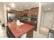Gourmet kitchen featuring stainless steel appliances, granite countertops, and a spacious center island at 3581 S Arizona Pl, Chandler, AZ 85286