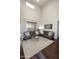 Inviting living room with comfortable seating, stylish rug, and ample natural light at 3581 S Arizona Pl, Chandler, AZ 85286