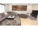 Spacious living room with a comfortable sectional sofa, modern coffee table, and stylish decor at 3581 S Arizona Pl, Chandler, AZ 85286