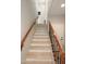 Open staircase with wood and iron railings leading to the upper level at 3581 S Arizona Pl, Chandler, AZ 85286