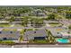 Charming single-story home featuring a refreshing turquoise pool, mature trees, and well-manicured lawns at 4010 E Coolidge St, Phoenix, AZ 85018