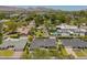 Aerial view highlighting a residence's landscaping, proximity to neighbors, and mountain views at 4010 E Coolidge St, Phoenix, AZ 85018
