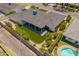 An aerial view of a beautiful backyard featuring a patio, well-manicured yard, and privacy fence at 4010 E Coolidge St, Phoenix, AZ 85018