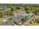 A high-angle aerial view of the house in a neighborhood featuring manicured landscaping at 4010 E Coolidge St, Phoenix, AZ 85018