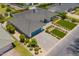 Bird's eye view of the home showing lush landscaping and a blue garage door at 4010 E Coolidge St, Phoenix, AZ 85018