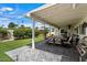 Charming covered patio with a grill and outdoor furniture, perfect for entertaining guests and enjoying al fresco dining at 4010 E Coolidge St, Phoenix, AZ 85018