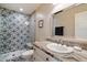 Stylish bathroom featuring custom tile shower and a vanity with counter space and plenty of storage at 4010 E Coolidge St, Phoenix, AZ 85018
