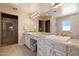 Elegant bathroom with double vanity, marble countertops, and a glass-enclosed shower at 4010 E Coolidge St, Phoenix, AZ 85018