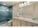 Bright bathroom showcasing a glass walk-in shower, vanity with plenty of storage, and modern fixtures at 4010 E Coolidge St, Phoenix, AZ 85018