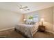 Relaxing bedroom featuring a window with natural light, plush bedding, and neutral décor for a peaceful ambiance at 4010 E Coolidge St, Phoenix, AZ 85018