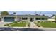 Charming single-story home with lush landscaping, blue accents, and a spacious two car garage at 4010 E Coolidge St, Phoenix, AZ 85018