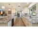 Spacious kitchen with white cabinets, stainless appliances, and a large granite island at 4010 E Coolidge St, Phoenix, AZ 85018