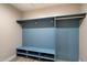 Organized mudroom area with blue cubbies and hooks at 4010 E Coolidge St, Phoenix, AZ 85018