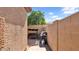Enclosed backyard features block wall, paver patio, swing and grill at 4167 E Hallihan Dr, Cave Creek, AZ 85331