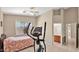 Bedroom with view to bathroom and an elliptical machine at 4167 E Hallihan Dr, Cave Creek, AZ 85331
