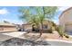 Inviting home featuring desert landscaping, a two car garage, and a mature shade tree at 4167 E Hallihan Dr, Cave Creek, AZ 85331