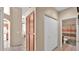 Hallway leading to the bathroom with cabinets and a closet on the side at 4167 E Hallihan Dr, Cave Creek, AZ 85331