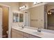 Bathroom featuring double sinks and a large mirror at 4223 E Danbury Rd, Phoenix, AZ 85032