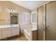 This bathroom features shower, bathtub, and window at 4223 E Danbury Rd, Phoenix, AZ 85032