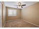 Bedroom with a window and a ceiling fan at 4223 E Danbury Rd, Phoenix, AZ 85032