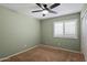 Bedroom featuring a ceiling fan and a window at 4223 E Danbury Rd, Phoenix, AZ 85032