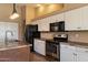 Close-up shot of the kitchen's stainless steel appliances and granite countertops at 4223 E Danbury Rd, Phoenix, AZ 85032