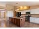 Kitchen featuring a center island, modern appliances, and tile flooring at 4223 E Danbury Rd, Phoenix, AZ 85032