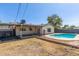 Backyard showcasing the pool, patio, and adjacent lawn area at 4238 W Krall St, Phoenix, AZ 85019