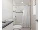Bright bathroom with shower and bathtub features white tile and updated showerhead at 4238 W Krall St, Phoenix, AZ 85019