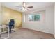 Bedroom featuring a gold accent wall, carpet, and desk area by the window at 4238 W Krall St, Phoenix, AZ 85019