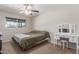 Cozy bedroom features natural light and a vanity area with a three-paneled mirror at 4238 W Krall St, Phoenix, AZ 85019