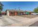 Quaint brick home with a well-maintained driveway and inviting front entrance at 4238 W Krall St, Phoenix, AZ 85019