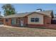 Charming brick home with a well-maintained yard and inviting front entrance at 4238 W Krall St, Phoenix, AZ 85019