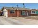 Quaint brick home with a well-maintained driveway, and inviting front entrance at 4238 W Krall St, Phoenix, AZ 85019