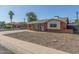Quaint brick home with a well-maintained yard, and inviting front entrance at 4238 W Krall St, Phoenix, AZ 85019
