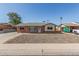 Quaint brick home with a well-maintained yard, extended driveway and inviting front entrance at 4238 W Krall St, Phoenix, AZ 85019