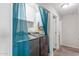 Laundry room with modern washer and dryer units and a storage closet at 4238 W Krall St, Phoenix, AZ 85019