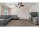 Comfortable living room with neutral paint, large window, fan and stylish entertainment center at 4238 W Krall St, Phoenix, AZ 85019