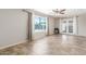 Spacious living room with lots of natural light, tile floors and access to the backyard at 4238 W Krall St, Phoenix, AZ 85019