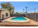 Backyard view of inground pool and block fence for privacy at 4238 W Krall St, Phoenix, AZ 85019