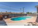 Backyard pool is surrounded by a concrete patio and a privacy fence at 4238 W Krall St, Phoenix, AZ 85019