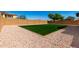 Low maintenance backyard is ready for you with plush green lawn and gravel landscaping at 4277 N 180Th Ln, Goodyear, AZ 85395