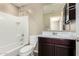 Bathroom with a tub and shower, vanity and a mirror at 4277 N 180Th Ln, Goodyear, AZ 85395